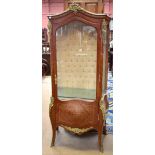 A reproduction French kingwood and marquetry vitrine, the single glazed door enclosing two fixed