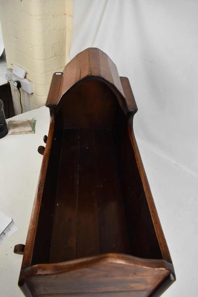 An early 20th century and later stained mahogany and pine child's rocking crib with arched partial - Image 3 of 3