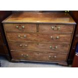 A George III mahogany chest of two short over three long graduated drawers, raised on bracket
