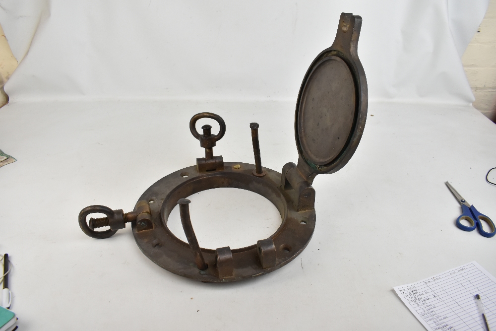 J STONE & CO OF DEPTFORD LONDON; a large brass porthole with swinging cover and lock and screw - Image 2 of 4