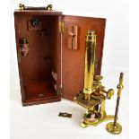 JOHN BROWNING OF LONDON; a 19th century brass plated microscope, with additional lenses, height 38.