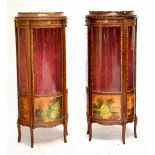 A pair of reproduction French vitrines, both with applied gilt metal detail, the doors decorated