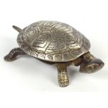 A late 19th/early 20th century chrome plated novelty desk bell in the form of a tortoise,