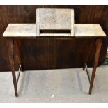 ARMY & NAVY; an oak rectangular campaign desk with adjustable slope, raised on tapering block