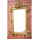 A 19th century gesso wall mirror with carved and pierced detail and applied sconces, height 110cm,