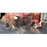 Two vintage bicycles including a Marlboro example, a vintage metal rocking horse and a metal scooter