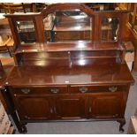 An early 20th century mahogany mirror back sideboard with two drawers above three panelled