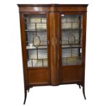 An Edwardian inlaid mahogany twin door display cabinet, raised on outswept supports, height 167cm,