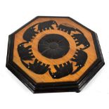 An early 20th century Anglo-Indian octagonal stand with carved and inlaid detail depicting an