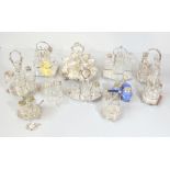 A group of silver plate mounted glass cruet sets and vinaigrettes, also a set of silver plated egg