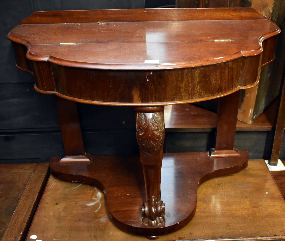 A Victorian mahogany duchess dressing table with hinged cover enclosing storage compartment on front