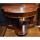 A Victorian mahogany duchess dressing table with hinged cover enclosing storage compartment on front