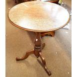 A 19th century oak tripod table on outswept supports, height 69.5cm, diameter 57cm.Additional