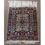 A 20th century Eastern silk rug with floral detail on a blue ground, 85 x 71cm.Additional