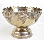 A large 20th century silver plated bottle cooler with cast and applied detail of grapes and vine