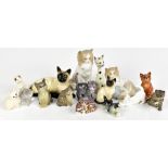 Sixteen ceramic and glass cat figures from various factories to include Beswick, Royal Crown