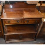 An Edwardian mahogany buffet with raised back above upper section set with two short drawers, with