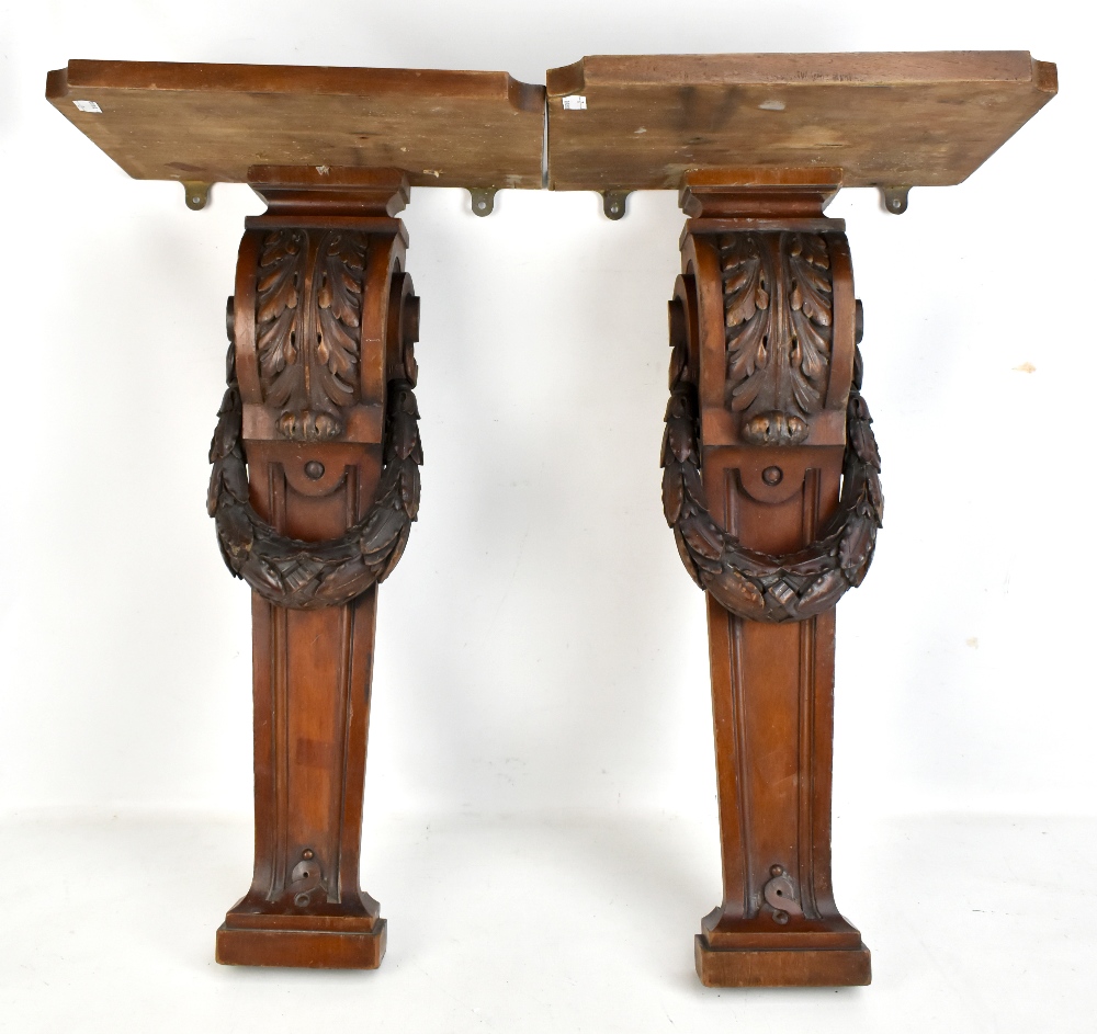 A pair of Victorian carved mahogany pilasters with acanthus scroll detail, now attached to platforms