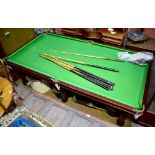 A combination mahogany dining table and snooker table with single-piece slate bed and modern