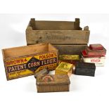 A collection of advertising boxes and tins including a wooden crate with paper label for Brown &