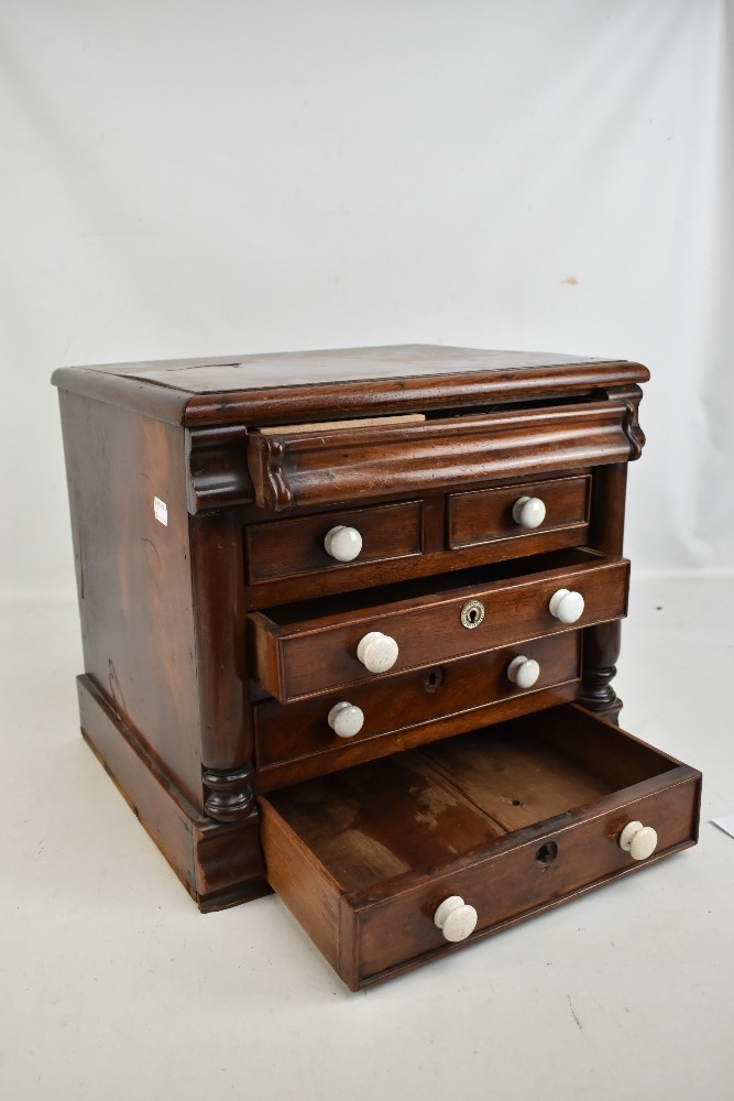 A Victorian mahogany miniature chest with secret drawer above two short and three long drawers, with - Image 2 of 4