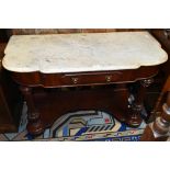 A Victorian mahogany Duchess dressing table with marble top above single frieze drawer, raised on