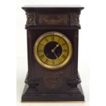 S MARTI & CIE; a Victorian slate mantel clock with bronzed metal applied mask heads and floral