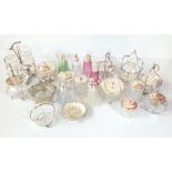 A group of silver plate mounted preserve jars and sugar casters including a cranberry glass example,