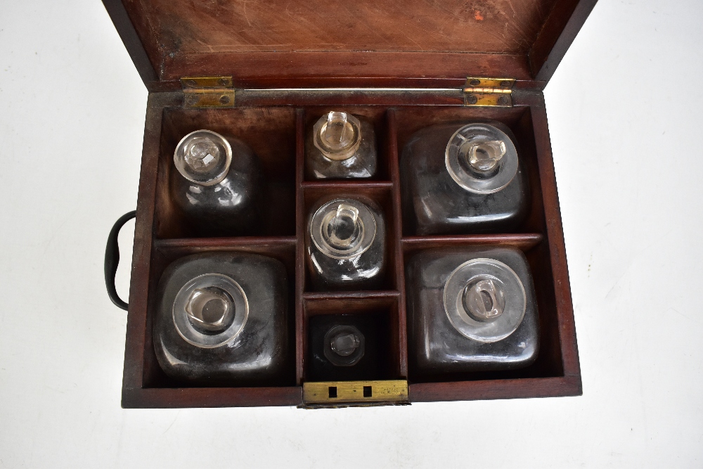 A Georgian mahogany apothecary cabinet, the hinged cover enclosing seven assorted bottles, height of - Image 2 of 2