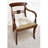 A Regency mahogany bar back armchair with carved detail and drop in seat. Additional