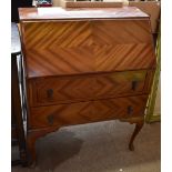 A mid-20th century mahogany veneered bureau, the fall front enclosing fitted interior above two