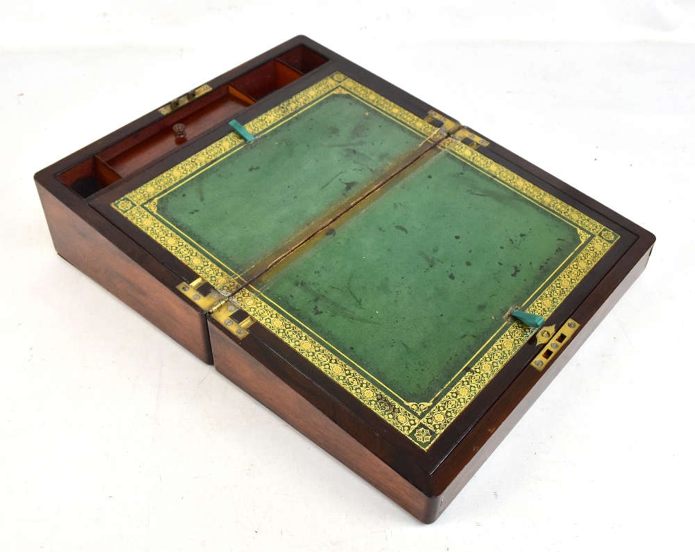 An early Victorian rosewood writing slope, the hinged lid set with mother of pearl rectangular