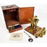 ABRAHAM & CO OPTICIANS OF LIVERPOOL; a 19th century brass plated microscope, height 36.5cm, with