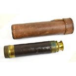 A small three drawer early 20th century brass telescope with stitched leather body and leather outer