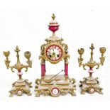 An early 20th century Continental gilt, spelter and porcelain three piece clock garniture, the clock