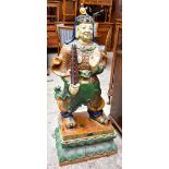 A reproduction sancai glazed figure of a Tibetan deity, raised on plinth base, height 134cm.