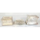 A B OF PARIS; a silver plated jewellery box of sarcophagus form with cast panelled detail of figures