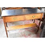 An early 20th century oak sideboard with black chalk painted top above two short drawers and under-