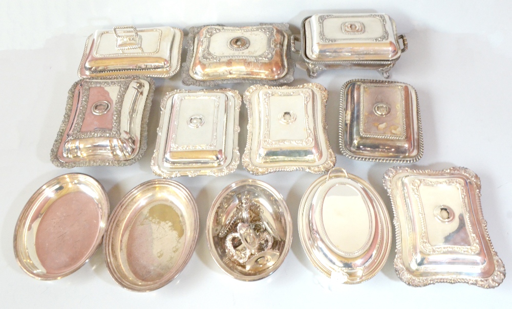 A group of silver plated entrée dishes including Alex Clark Manufacturing Co example with cast