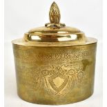 A decorative brass biscuit box with pineapple finial and engraved detail, length 17cm.Additional