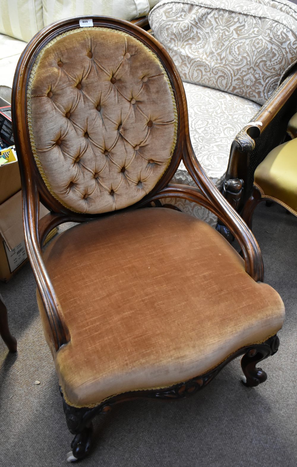 A Victorian walnut framed armchair with yellow upholstery on carved cabriole supports. Additional