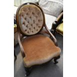 A Victorian walnut framed armchair with yellow upholstery on carved cabriole supports. Additional