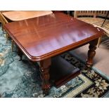 A Victorian mahogany extending dining table with two extra leaves, the moulded top raised on lobed