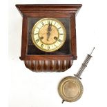 An early 20th century beech cased wall clock, the circular dial set with Roman numerals, 29 x 28cm.