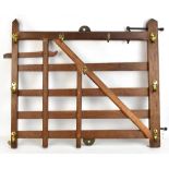 A 19th century oak nursery gate with later brass coat hooks, height 67cm, width 83cm.