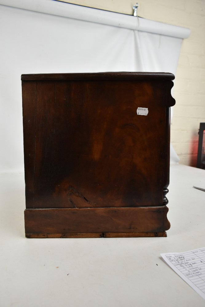 A Victorian mahogany miniature chest with secret drawer above two short and three long drawers, with - Image 4 of 4