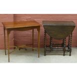 An Edwardian line inlaid mahogany occasional table on tapering block supports, height 69cm, length