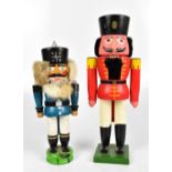A pair of painted wooden novelty nutcrackers, height of larger example 39cm (2).