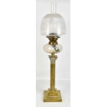 A Victorian brass Corinthian column oil lamp with cut glass reservoir and frosted glass shade,