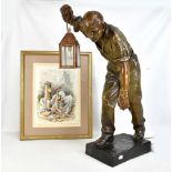 AFTER DOEBRICH; a bronzed resin lamp modelled as a miner carrying a copper lamp, on rectangular base